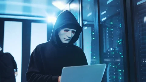 Anonymous risky hacker coding spyware programs on laptop, breaking into database Stock Footage 120694561