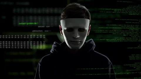 Anonymous scary hacker taking off mask, IT criminal disclosure, confession Video stock 83016497