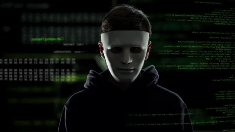 Anonymous scary hacker taking off mask, IT criminal disclosure, confession Video stock 83018795