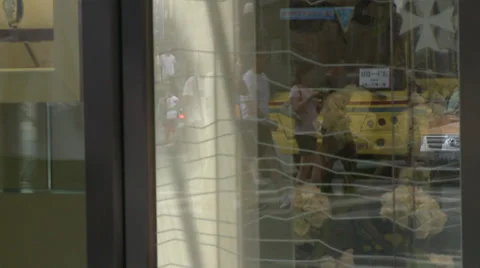 Anonymous shoppers + shop window reflections Stock Footage 38168619