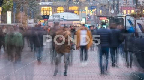 The anonymous smashed people crowd flow. Telephoto lens shot Stock Photos