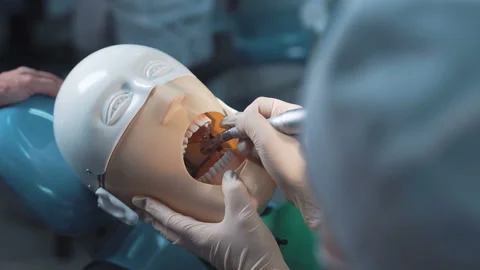 Anonymous student practicing dentistry Stock Footage 100559541