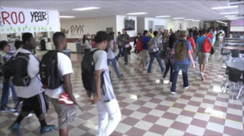 Anonymous students walking through a hallway Stock Footage 34525683