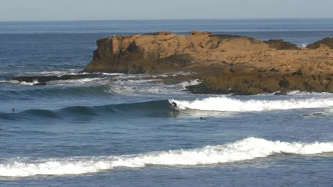 Anonymous Surfer Surfing Clean Wave on Atlantic Ocean next to Cliffs in Morocco Stock Footage 237095345