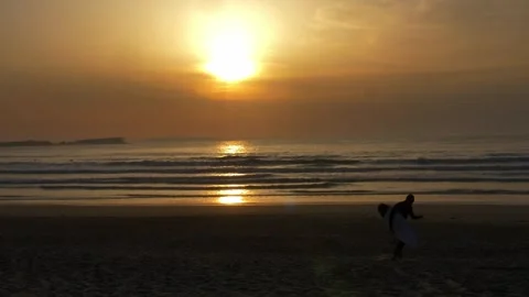 Anonymous Surfer Walking on Atlantic Ocean Coast Sandy Beach in Portugal Stock Footage 250531712