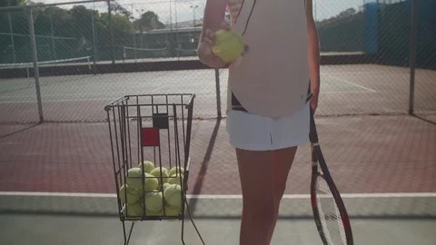 Anonymous tennis player bouncing ball on court Video stock 85648448