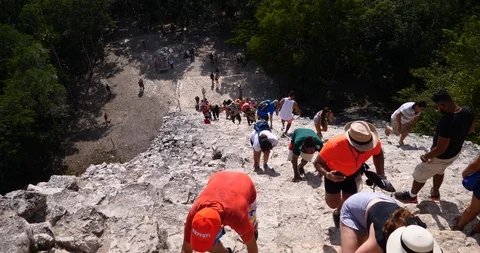 Anonymous tourist walking and visiting coba mayan mexico pyramid Stock Footage 101734875