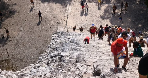 Anonymous tourist walking and visiting coba mayan mexico pyramid Stock Footage 101735111