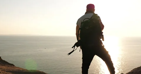 Anonymous traveler standing on a cliff looking at Strait of Hormoz Stock Footage 172044604