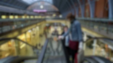 Anonymous travelers Going Up Escalator at Large Railway Station Stock Footage 112123571