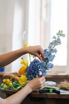 Anonymous woman creating japanese flower arrangement Stock Photos