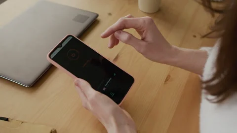 Anonymous Woman Setting Up VPN Internet Connection on Smartphone Stock Footage 332445104