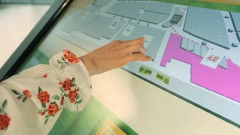 Anonymous woman using navigation board in mall. Stock Footage 97759638
