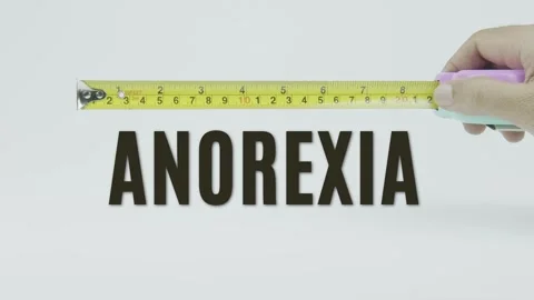 Anorexia text or word and tape measure on a white background Stock Footage 302037152