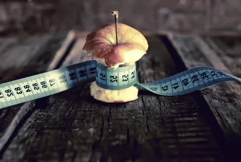 Anorexia thinness measuring apple Stock Photos