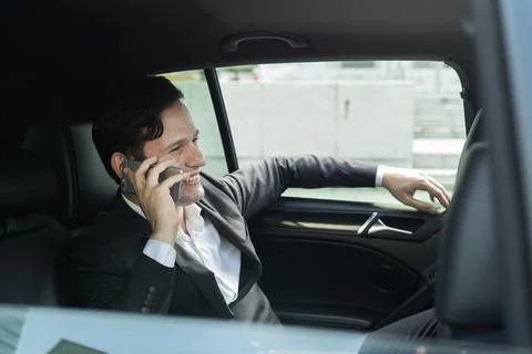 Another expression Face of Businessman when ride car talking about good news  Fotos de archivo