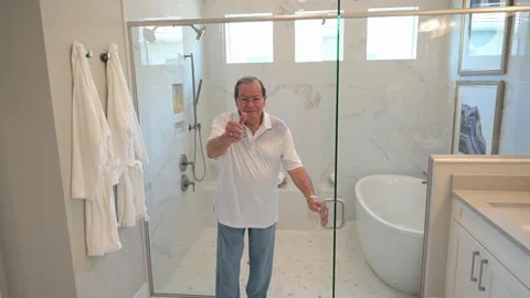 Another happy customer after a complete bathroom modernization remodeling Stock Footage 282357768