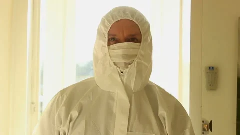 Another Medium close up shot of a male wearing protective mask and hazmat suit Stock Footage 142577818
