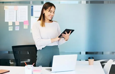 Another task done for the day. an attractive young businesswoman standing alone Stock Photos