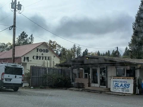 Another view of modest small-town businesses with ground signage Stock Photos