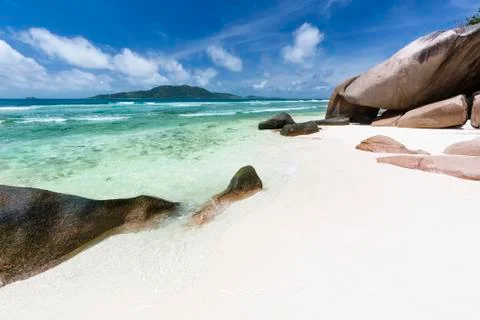 Anse grosse roche in la digue, seychelles with clear water and granite rocks Stock Photos