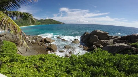 Anse Intendance. Waves break against the rocks. Stock Footage 73800097