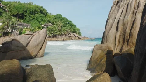 Anse Patates beach on La Digue island features tropical sand, boulders Vídeos de archivo 331505783