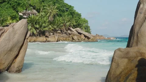 Anse Patates beach on La Digue island features tropical sand, boulders Vídeos de archivo 331505785