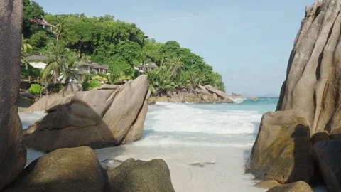 Anse Patates beach on La Digue island features tropical sand, boulders Stock-Footage 331505787