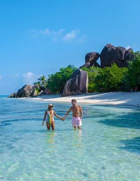Anse Source d'Argent, La Digue Seychelles, a young couple of men and women on a Stock Photos