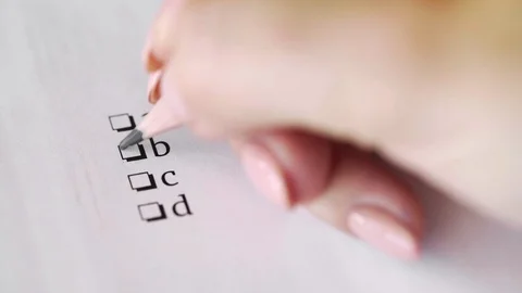 Answer B. Pencil writing answer on paper answer of question in examination test. Vídeos de archivo 118700225