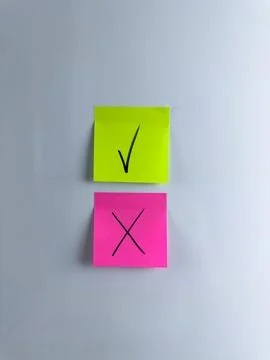 Answer choice symbol with check mark and cross on sticky note Stock Photos