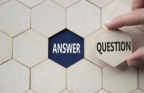 Answer or Question symbol. Concept word Answer or Question on wooden comb p.. Stock Photos