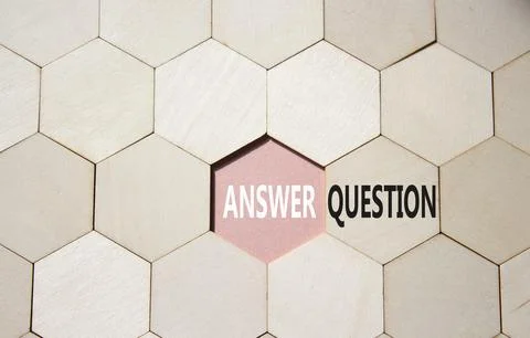 Answer or Question symbol. Concept word Answer or Question on wooden comb p.. Stock Photos