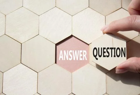 Answer or Question symbol. Concept word Answer or Question on wooden comb p.. Stock Photos
