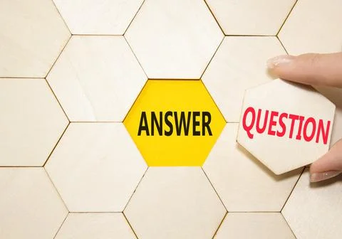 Answer or Question symbol. Concept word Answer or Question on wooden comb p.. Stock Photos