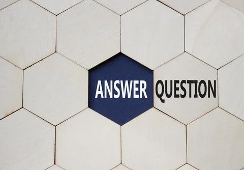 Answer or Question symbol. Concept word Answer or Question on wooden comb p.. Stock Photos