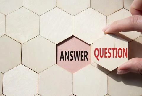 Answer or Question symbol. Concept word Answer or Question on wooden comb p.. Stock Photos