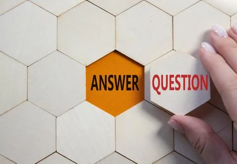 Answer or Question symbol. Concept word Answer or Question on wooden comb puz Stock Photos
