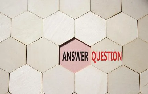 Answer or Question symbol. Concept word Answer or Question on wooden comb p.. Stock Photos
