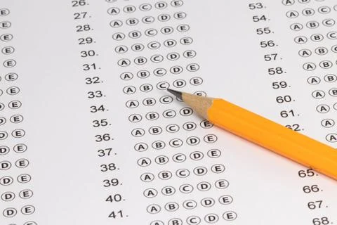 Answer sheet form with pencil on table, close up. Concept of passing exam Stock Photos