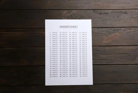 Answer sheet on wooden background, top view 写真素材