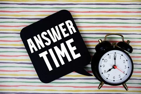 Answer Time text on speech bubble with alarm clock on colorful stripes back.. Stock Photos