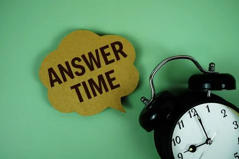 Answer Time text on speech bubble with alarm clock on green background Stock Photos