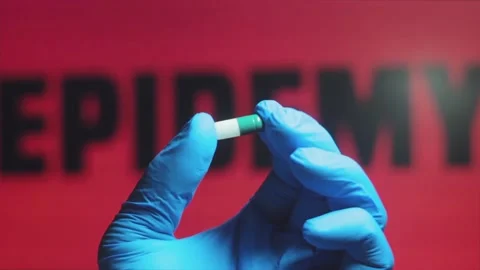 Answer To A Virus Pandemic - Epidemiologist Holding Panacea For The Epidemic Stock Footage 135401930