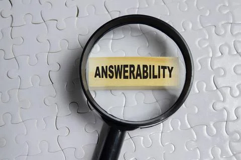 Answerability on stacked wooden cubes on the table. Business and finance Stock Photos