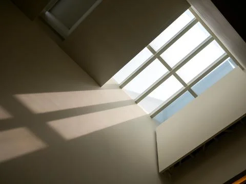 Ant eyes view of ceiling window glass roof decorating the modern building's.. Stock Photos