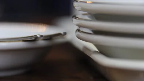 Ant Moving Between Stacked White Plates in Minimal Kitchen Scene Stock Footage 331931255