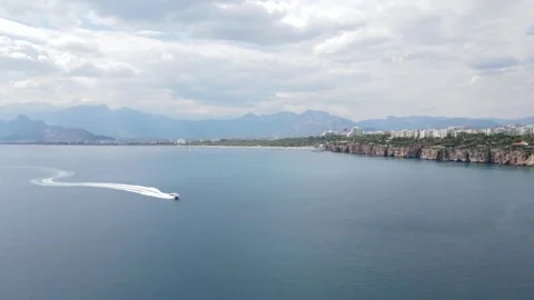 Antalya Coastline Drone Fly Forward Meeting Speedboat 4K Stock Footage 336959600
