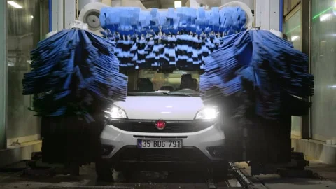 Antalya, Turkey - CIRCA 2023: Automatic car wash at night. white Fiat Doblo car Stock Footage 229400217